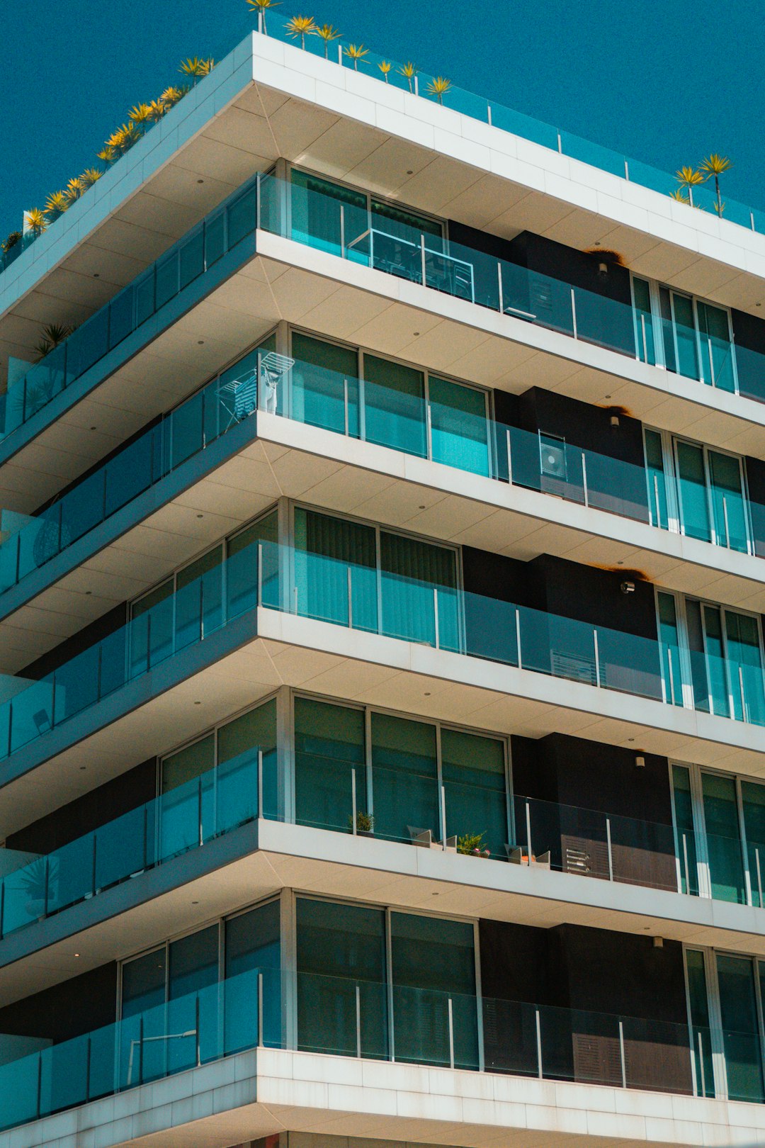 a-tall-building-with-balconies-and-balconies-on-the-balconies-y386aoezqq